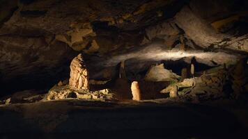 Discover the Mysterious Cave Formation adorned with Illuminated Statues and unique beauty video