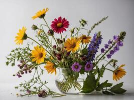 An Elegant Arrangement of Vibrant Wildflowers in a Clear Glass Vase photo