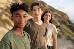Three teenage friends enjoying a leisurely walk along the local coast, with natural scenery and warm lighting creating a relaxed, carefree atmosphere. photo