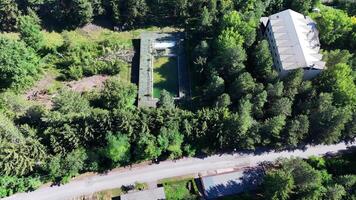 Abandoned Pool Surrounded by Lush Greenery in Remote Forested Area During Bright Daylight video