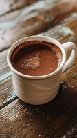 Rustic ceramic mug filled with rich hot chocolate on wooden table, perfect for cozy winter warmth photo