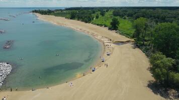 Aerial view of a sandy beach and calm waters. Lake Michigan, Illinois, Beach video