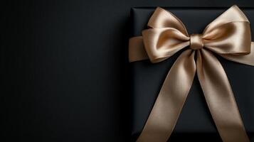 A black background with a ribbon bow elegantly tied and placed in the upper corner, creating a luxurious gift feel with empty space photo