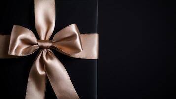 A black background with a ribbon bow elegantly tied and placed in the upper corner, creating a luxurious gift feel with empty space photo