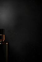 A black background with a faint shine and the hint of luxury products in the corners, perfect for adding advertising text photo