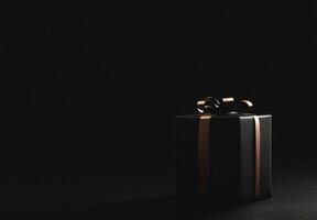 A black background with the silhouette of a gift box slightly off-center, ideal for promotional banners with copy space photo