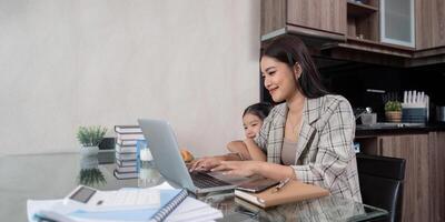 Mother Working from Home with Daughter. Balancing Remote Work and Parenting photo
