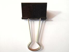Black paperclip on a white background photo