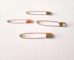 safety pins on a white background photo