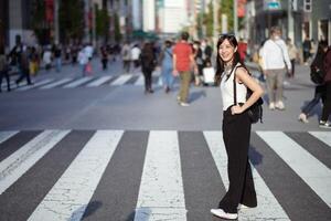 Tokyo swirl, Unrecognizable individuals navigating the urban crosswalk, a snapshot of daily activity. photo