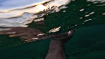Man's hand drowning in the sea video