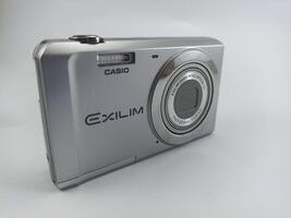 wonosobo central java indonesia august 7 2024 front view of old casio digital pocket camera isolated on white background, casio exilim, photography equipment photo
