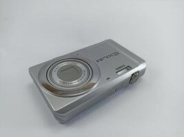 wonosobo central java indonesia august 7 2024 front view of old casio digital pocket camera isolated on white background, casio exilim, photography equipment photo