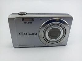 wonosobo central java indonesia august 7 2024 front view of old casio digital pocket camera isolated on white background, casio exilim, photography equipment photo