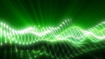 Glowing green light waves flow smoothly across a dark background, creating video