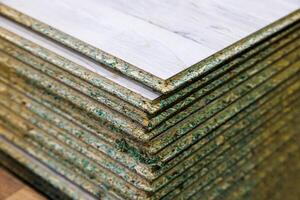 stacks of tongue and groove water resistant OSB compressed sawdust sheets photo