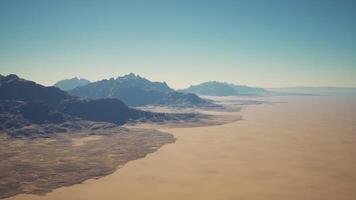 Aerial View of Desert With Background Mountains video