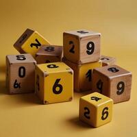 Wooden numeric cubes on a striking yellow background, each showcasing distinct carved numbers for a playful feel photo