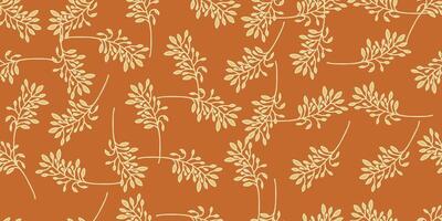 a pattern of leaves on an orange background vector