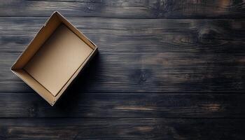 Flat lay brown empty open cardboard box carton package for packing copy space wooden background photo