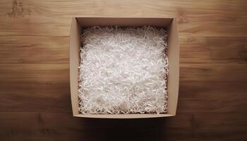 Cardboard brown box with shredded paper safety fragile product delivery shipment photo