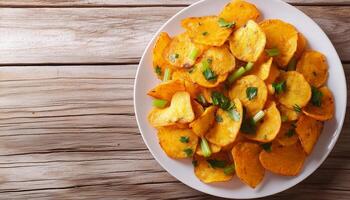 Pumpkin fried chips snack homemade in plate wooden background photo