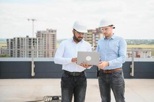 two architect engineers are walking in a constructed office building. implementation of the project photo