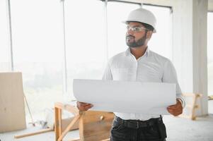 Asian Engineer standing on site construction posting confident , Engineer construction happy job success photo