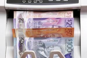 Barbadian dollar in the counting machine photo