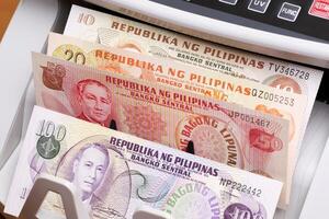Philippine peso in the counting machine photo