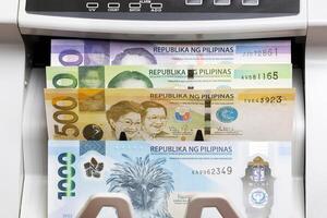 Philippine peso in the counting machine photo
