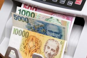 Israeli new shekel in the counting machine photo