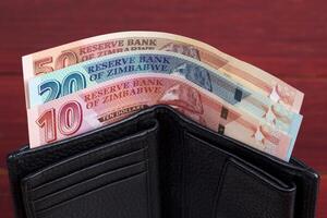 Zimbabwean banknotes in the black wallet photo