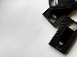 Vintage vhs cassettes on white background. nostalgic media and retro technology photo