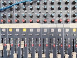 Top view of knobs with button of sound music mixer control panel. photo