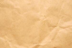 Abstract crumpled and creased recycle brown paper texture background photo