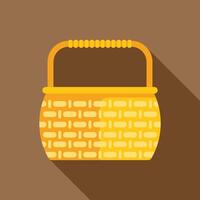 Yellow wicker picnic basket icon with long shadow vector