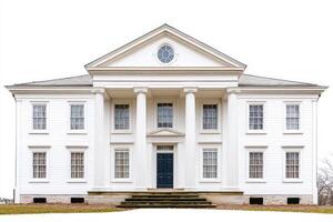 A classic white-columned mansion with a pediment and symmetrical windows. photo