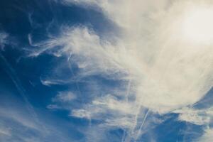 Blue sky background with clouds photo