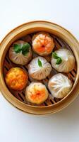 Steamed Dumplings with Shrimp and Vegetable Fillings in a Bamboo Steamer photo