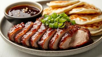 Sliced Roasted Duck with Pancakes, Green Onions, and Dipping Sauce photo