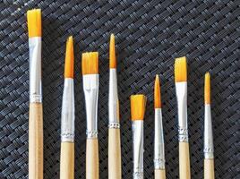 Shot of the different painting brushes with sizes marking on them. Art and craft photo