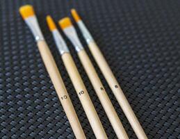 Shot of the different painting brushes with sizes marking on them. Art and craft photo