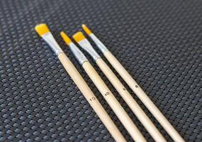 Shot of the different painting brushes with sizes marking on them. Art and craft photo