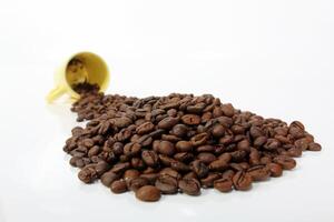 Roasted coffee beans on white background photo