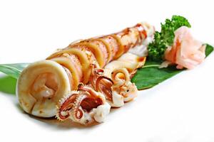 Grilled ika yaki, Fresh squid grill sliced into rings with the tentacles on white background photo