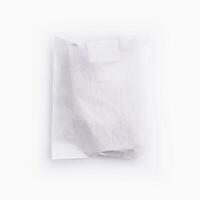 Crumpled white paper bag with blank label for branding mockup photo