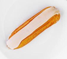 Fresh eclair pastry on white background photo