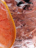 Close-up of iced drink with grapefruit slice photo