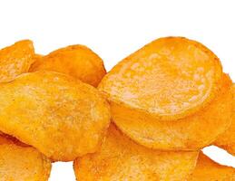 Crispy golden potato chips isolated on white photo